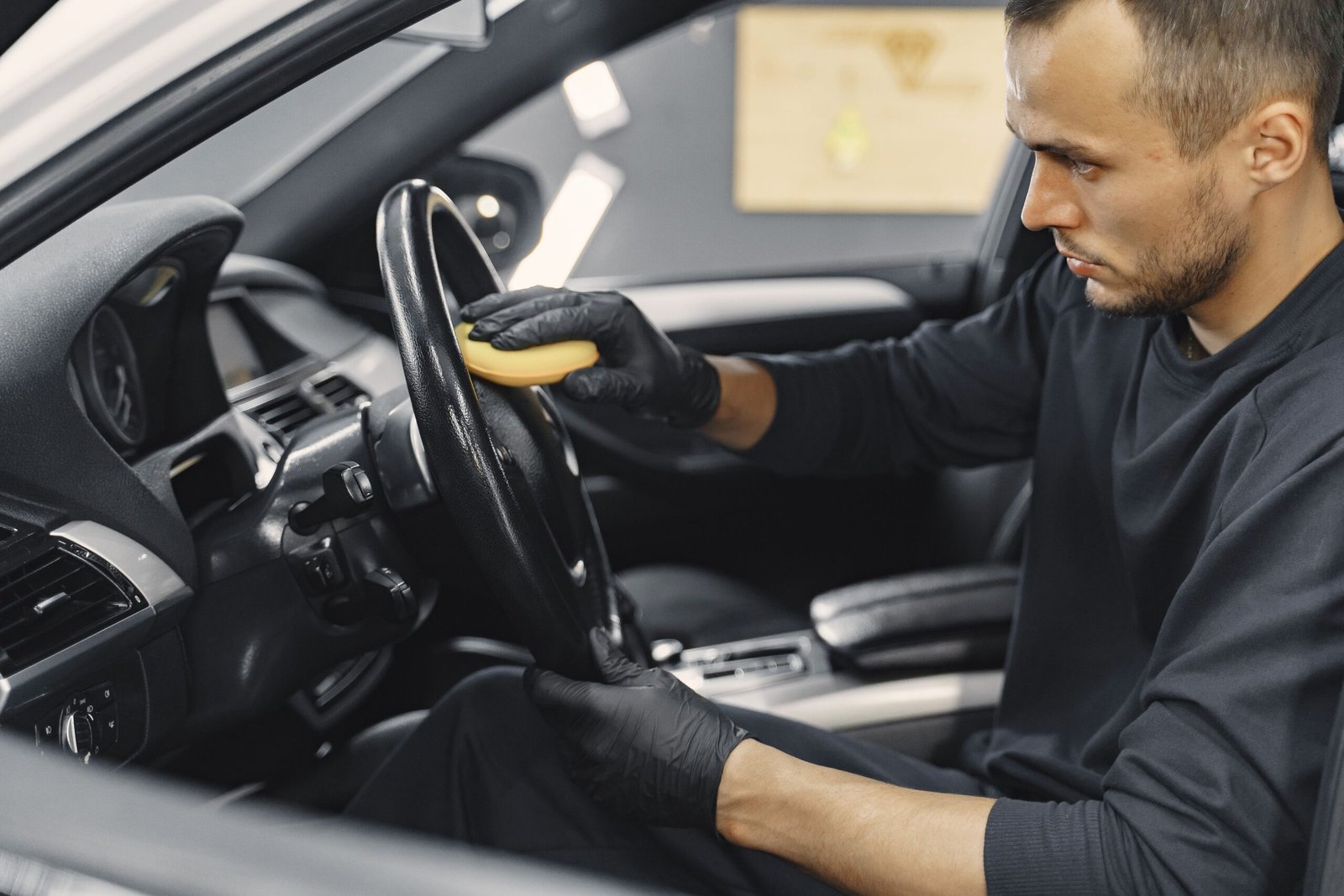 man-polish-salon-car-garage